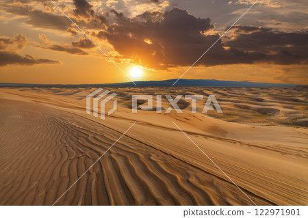 Sunset over the sand dunes in the desert. Sahara desert 122971901