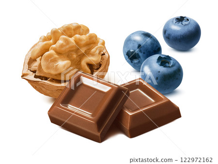 Walnut nut, fresh blueberries and milk chocolate squares isolated on white background Walnut nut, fresh blueberries and milk chocolate squares isolated on white background 122972162