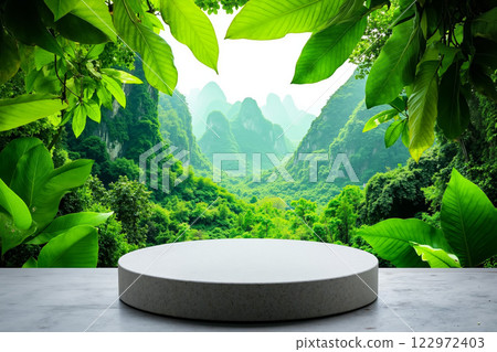 A round table in the middle of a lush green forest 122972403