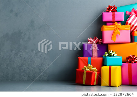 A pile of brightly colored presents with bows and ribbons 122972604