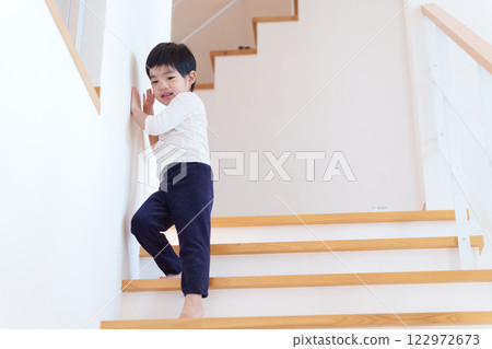 Child getting off the stairs 122972673