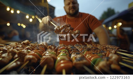 Grilling Meat Skewers at Vibrant Street Food Vendor Market Scene 122973163