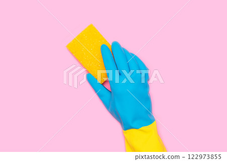 Cleaning services, hand with a yellow sponge 122973855