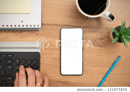 Smartphone mockup, empty screen on desk Smartphone mockup, empty screen on desk 122973859