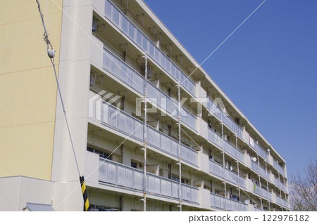 Real estate image: Old apartment building on a sunny day 122976182