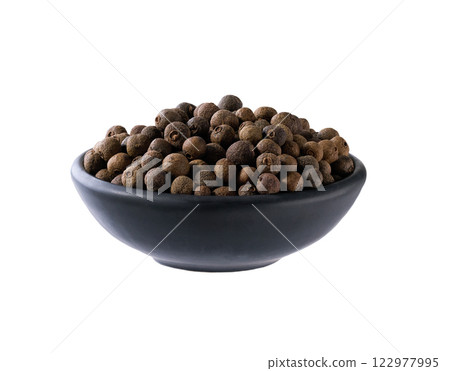 black ceramic bowl with allspice or Jamaican pepper isolated on white background. 122977995