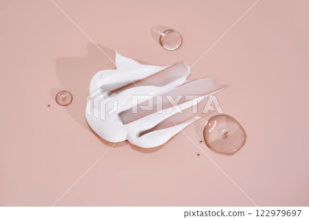 The texture of white cream on a pink background. The texture of white cream on a pink background. 122979697
