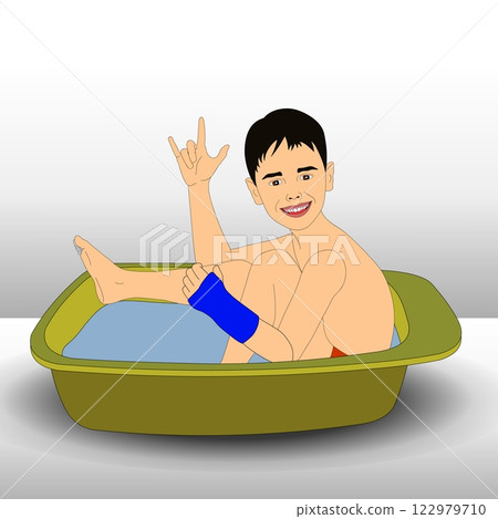 A child is sitting in a small tub filled with water, smiling and making a playful hand gesture.  122979710