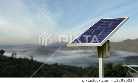 A solar panel set up in a remote location, providing electricity to homes without access to the main grid. 122980024