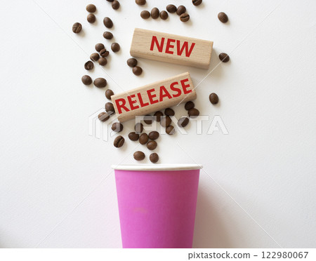 New Release symbol. Concept word New Release on wooden blocks. Beautiful white background with coffee cup. Business and New Release concept. Copy space New Release symbol. Concept word New Release on wooden blocks. Beautiful white background with coffee cup. Business and New Release concept. Copy space 122980067