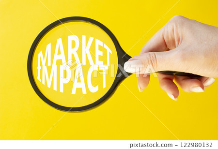 Market impact symbol. Concept word Market impact on magnifying glass. Beautiful yellow background. Businessman hand. Business and Market impact concept. Copy space. Market impact symbol. Concept word Market impact on magnifying glass. Beautiful yellow background. Businessman hand. Business and Market impact concept. Copy space. 122980132
