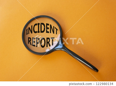 Incident Report symbol. Concept word Incident Report on magnifying glass. Beautiful orange background. Business and Incident Report concept. Copy space Incident Report symbol. Concept word Incident Report on magnifying glass. Beautiful orange background. Business and Incident Report concept. Copy space 122980134