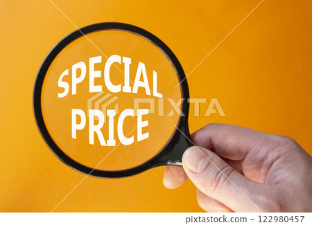 Special Price symbol. Magnifying Glass with Concept word Special Price. Businessman hand. Beautiful orange background. Business and Special Price concept. Copy space Special Price symbol. Magnifying Glass with Concept word Special Price. Businessman hand. Beautiful orange background. Business and Special Price concept. Copy space 122980457