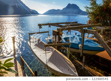 Boats pn shore in waiting of spring on Lugano lake 122980545