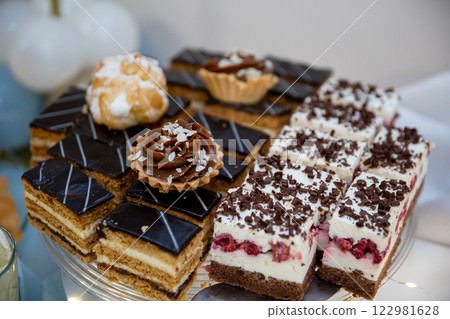 An Elegant Display of Delicious, Colorful Desserts Artfully Arranged on a Platter 122981628