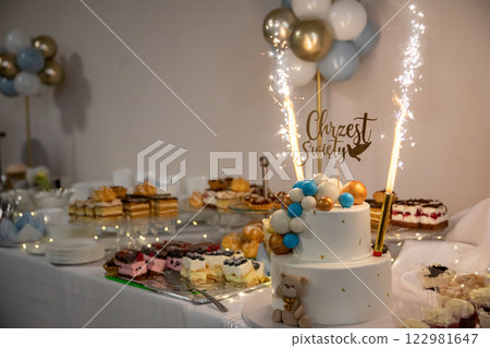 A vibrant Celebration Table adorned with a delightful Cake and elegant Decor pieces 122981647