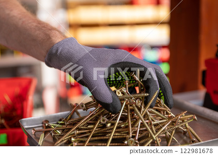 Professional Hand Stocking of Various Hardware Items in the Workshop Environment Professional Hand Stocking of Various Hardware Items in the Workshop Environment 122981678