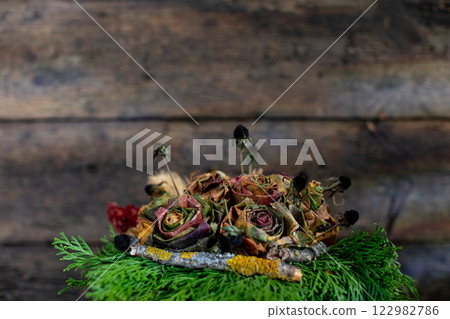 An Elegant and Charming Arrangement of Beautiful Dried Flowers and Lush Greenery An Elegant and Charming Arrangement of Beautiful Dried Flowers and Lush Greenery 122982786