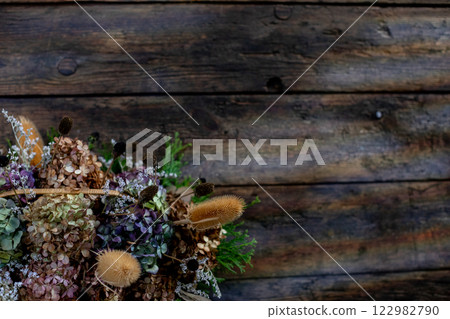 A Beautifully Dried Floral Arrangement on Rustic Wood, Perfect for Aesthetic Home Decor 122982790