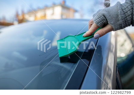 Efficiently Scraping Ice Off Your Car Windshield During Frigid Winter Weather Conditions Efficiently Scraping Ice Off Your Car Windshield During Frigid Winter Weather Conditions 122982799