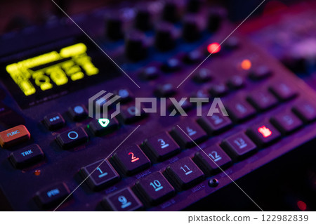 CloseUp View of a Music Production Device Within a DJ Setup for Creating Sound and Vibes 122982839