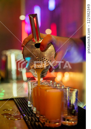 Craft Cocktail Preparation in a Contemporary Bar Setting That Engages Customers and Guests Craft Cocktail Preparation in a Contemporary Bar Setting That Engages Customers and Guests 122982849