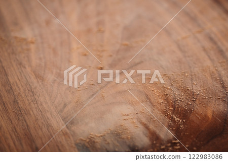 Black walnut table with dust from sanding 122983086