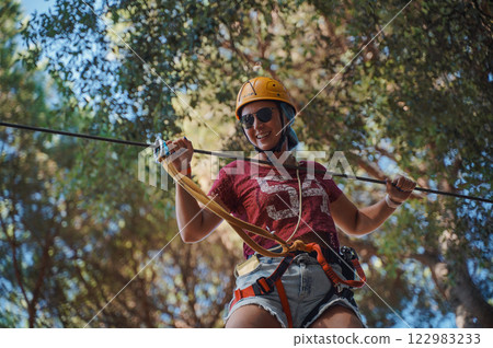 Extreme sport in forest adventure park 122983233