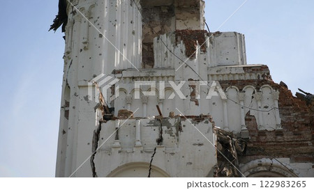 View to destroyed church at Kharkivska oblast. Ruined building after bomb attacks on ukrainian territory from russia army. Consequences of russian invasion of Ukraine. Slow motion 122983265