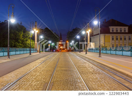 The Church of the Holy Saviour in Poznan and the Theatre Bridge at dawn. The Church of the Holy Saviour in Poznan and the Theatre Bridge at dawn. 122983443