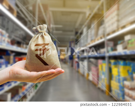Indian rupee money bag on the background of a grocery store counter with products food. Concept of cost of goods. Grocery set. Import and export. Wholesale Indian rupee money bag on the background of a grocery store counter with products food. Concept of cost of goods. Grocery set. Import and export. Wholesale 122984031