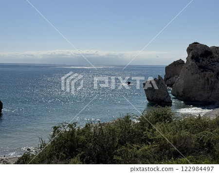 Scenic beach and rock formations in Cyprus. Mediterranean Sea, road, travel, view of mountains and sea. Scenic beach and rock formations in Cyprus. Mediterranean Sea, road, travel, view of mountains and sea. 122984497