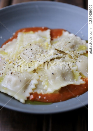 Ravioli with tomato sauce 122986602