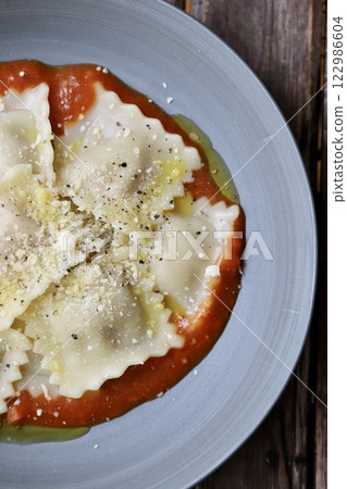 Ravioli with tomato sauce 122986604