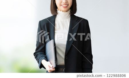 Woman with a laptop / business woman Woman with a laptop / business woman 122988806