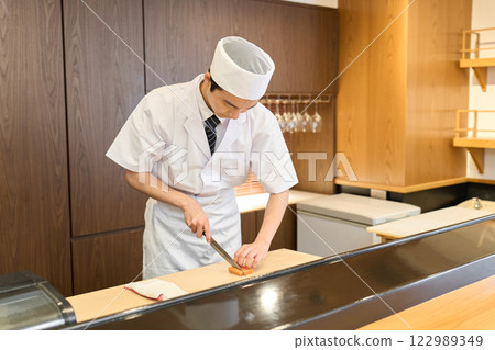 A Japanese chef cooking A Japanese chef cooking 122989349