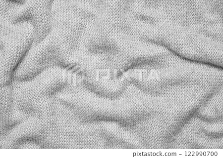 Close up texture of light gray crumpled woven fabric with a subtle pattern of evenly spaced tiny dots, providing a soft, neutral background ideal for design and creative projects Close up texture of light gray crumpled woven fabric with a subtle pattern of evenly spaced tiny dots, providing a soft, neutral background ideal for design and creative projects 122990700