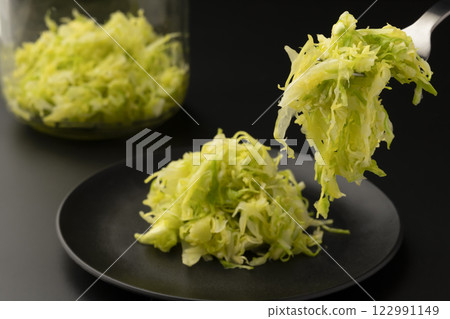 Lift the sauerkraut with a fork Lift the sauerkraut with a fork 122991149