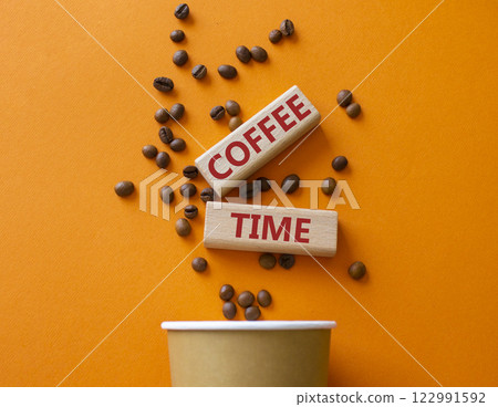 Coffee Time symbol. Concept word Coffee Time on wooden blocks. Beautiful orange background with coffee cup. Business and Coffee Time concept. Copy space 122991592