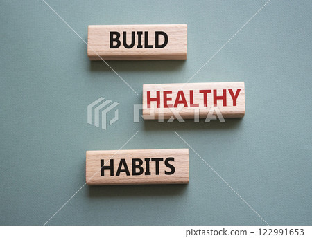 Healthy habits symbol. Concept word Build Healthy habits on wooden blocks. Beautiful grey green background. Healthy lifestyle and Healthy habits concept. Copy space Healthy habits symbol. Concept word Build Healthy habits on wooden blocks. Beautiful grey green background. Healthy lifestyle and Healthy habits concept. Copy space 122991653