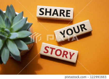 Share your story symbol. Wooden blocks with words Share your story. Beautiful orange background with succulent plant. Business and Share your story concept. Copy space. 122991663