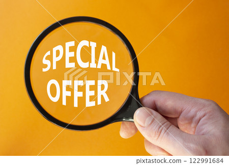 Special offer symbol. Concept word Special offer on wooden blocks. Businessman hand. Beautiful orange background. Business and Special offer concept. Copy space Special offer symbol. Concept word Special offer on wooden blocks. Businessman hand. Beautiful orange background. Business and Special offer concept. Copy space 122991684