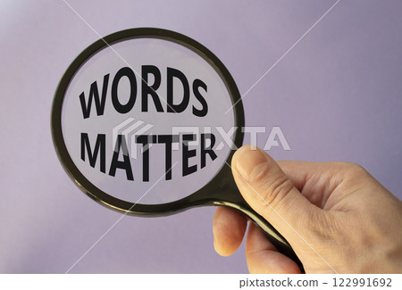Words Matter symbol. Magnifying Glass with Concept word Words Matter. Businessman hand. Beautiful purple background. Business and Words Matter concept. Copy space Words Matter symbol. Magnifying Glass with Concept word Words Matter. Businessman hand. Beautiful purple background. Business and Words Matter concept. Copy space 122991692