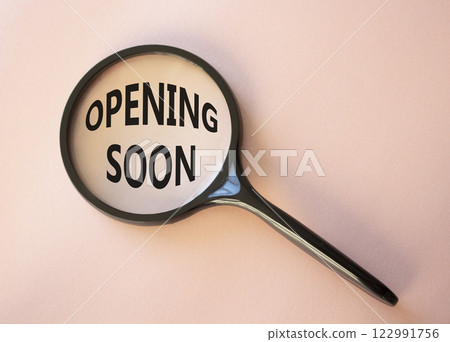 Opening soon symbol. Magnifying Glass with Concept word Opening soon. Beautiful pink background. Business and Opening soon concept. Copy space 122991756