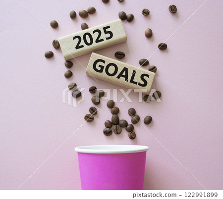 2025 Goals symbol. Concept word 2025 Goals on wooden blocks. Beautiful pink background with coffee cup. Business and 2025 Goals concept. Copy space. 2025 Goals symbol. Concept word 2025 Goals on wooden blocks. Beautiful pink background with coffee cup. Business and 2025 Goals concept. Copy space. 122991899