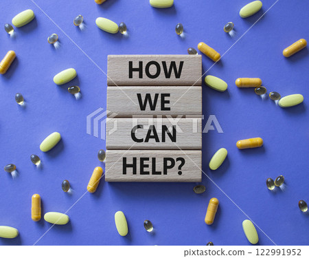 How we can help symbol. Concept word How we can help on wooden blocks. Beautiful purple background with pills. Medicine and How we can help concept. Copy space 122991952