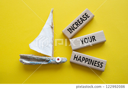 Increase your Happiness symbol. Concept words Increase your Happiness on wooden blocks. Beautiful yellow background with boat. Business and Increase your Happiness concept. Copy space Increase your Happiness symbol. Concept words Increase your Happiness on wooden blocks. Beautiful yellow background with boat. Business and Increase your Happiness concept. Copy space 122992086