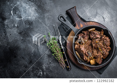 Beef bourguignon stew with tender beef in a pan. black background. top view 122992182