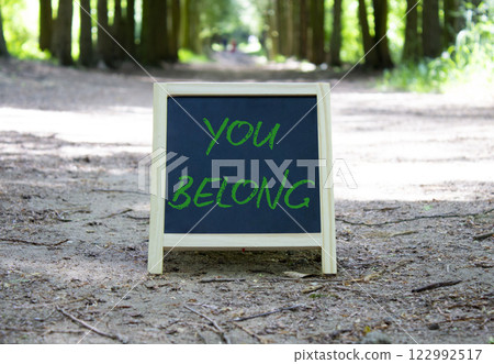 You belong symbol. Blackboard with words You belong. Beautiful forest background. Business and You belong concept. Copy space. 122992517