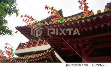 Roof detail of Buddha Tooth Relic Temple in Singapore, showcasing its intricate red architecture 122992700